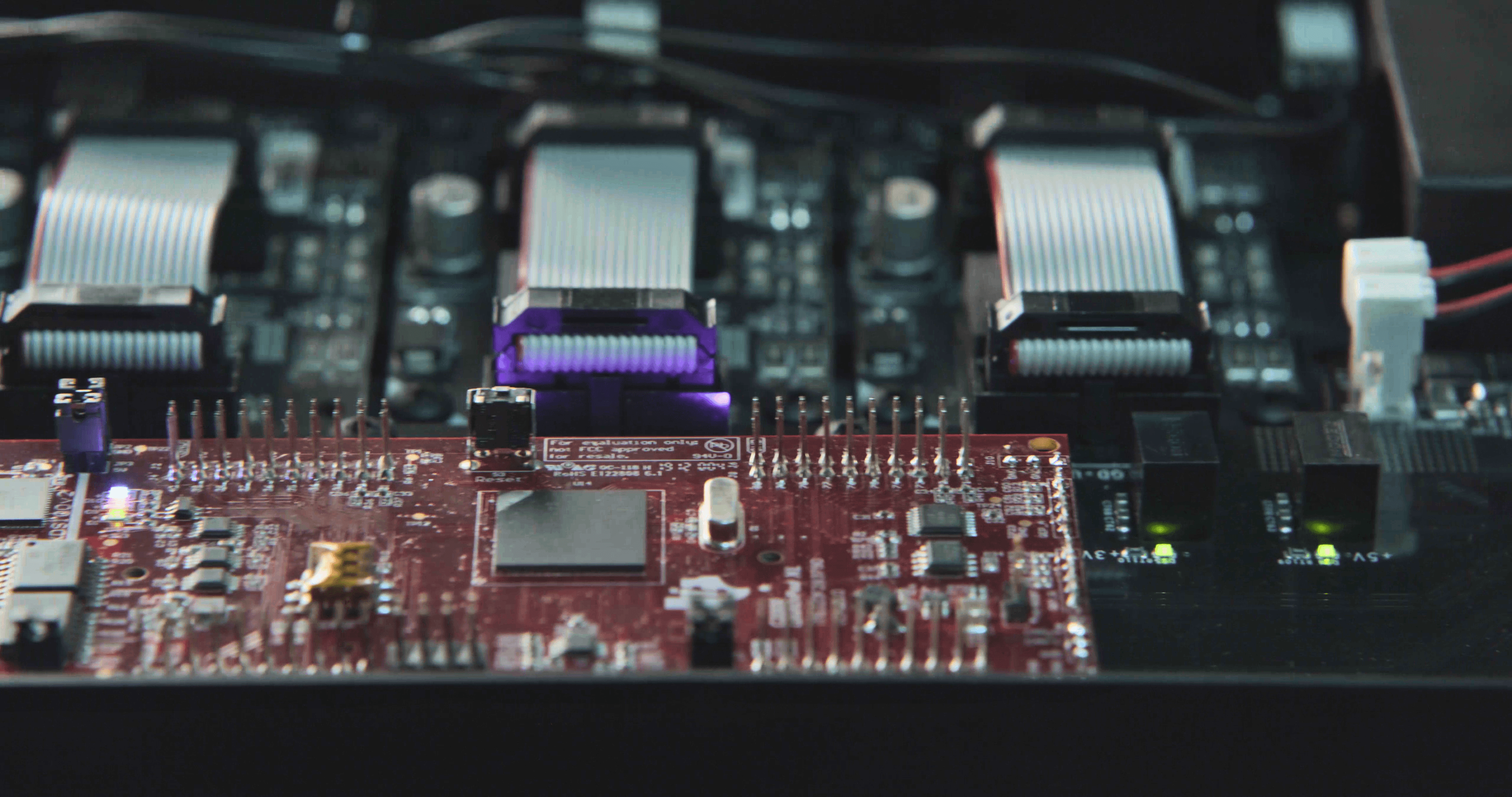 Diverse group of professionals collaborating in a workshop, exchanging high-fives and ideas in a dynamic learning environment.