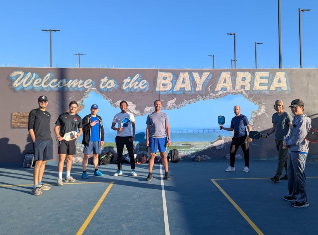 Employees collaborating in a creative workshop, engaging in teamwork and problem-solving activities.